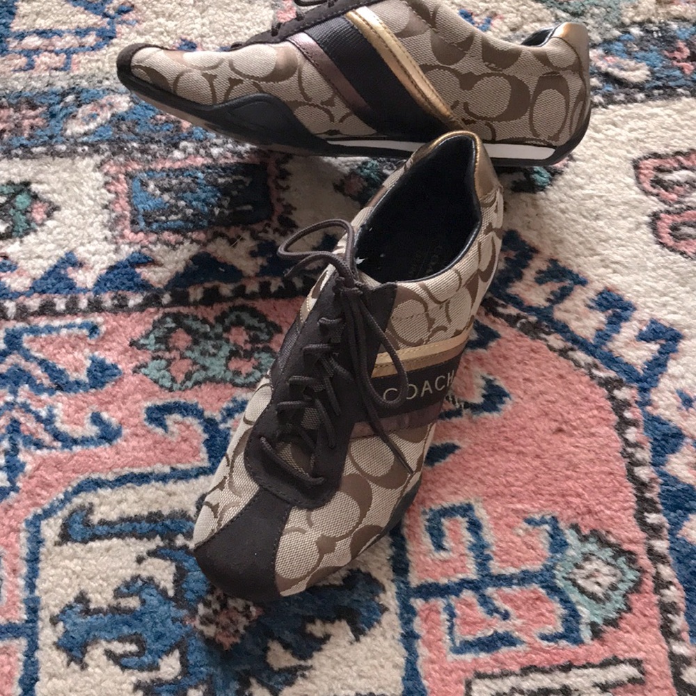 Stylish bronze tan iconic Coach print shoes.